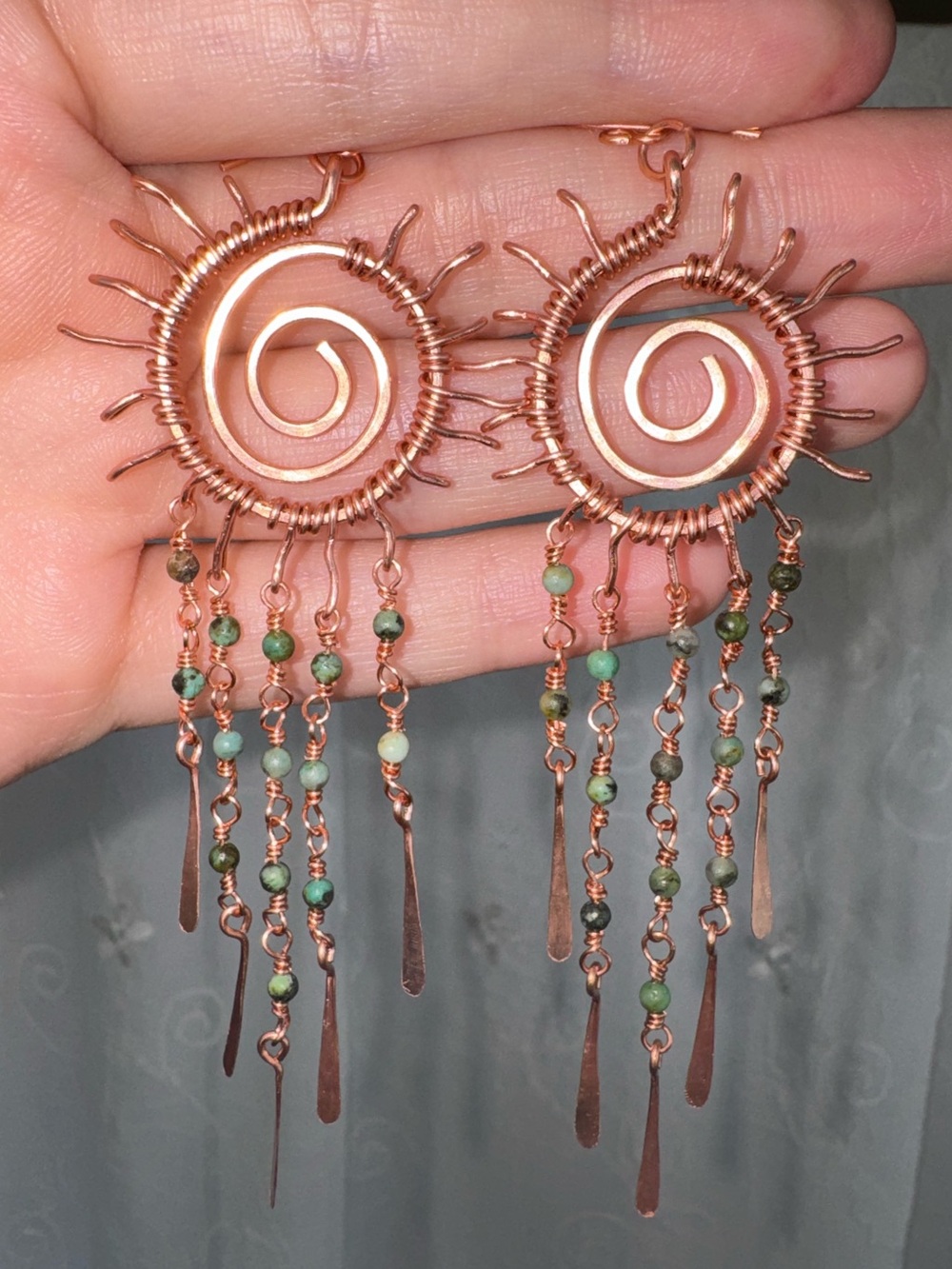 Handcrafted Copper Spiral Sun Earrings with Green Beads